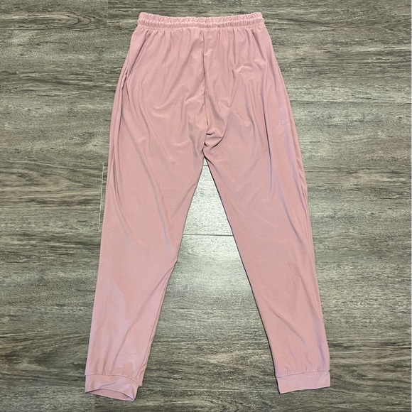 Large mauve jogger pants with metallic circle holes on bottom - Picture 4 of 4